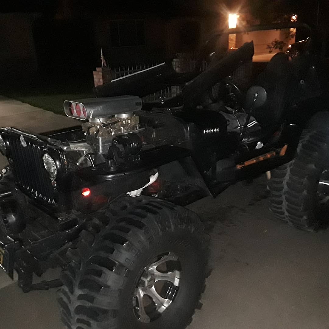 1946 Willys Jeep — supercharged, mud tires, night shot