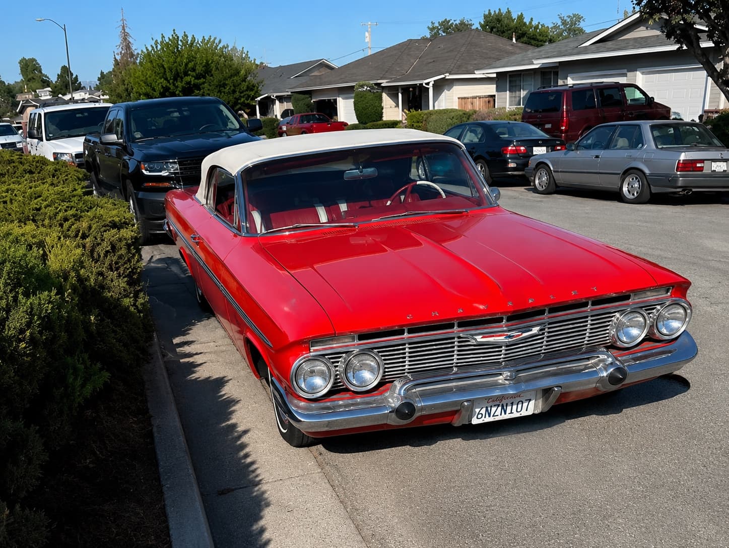 1961 Chevrolet Impala — red, front three-quarter view